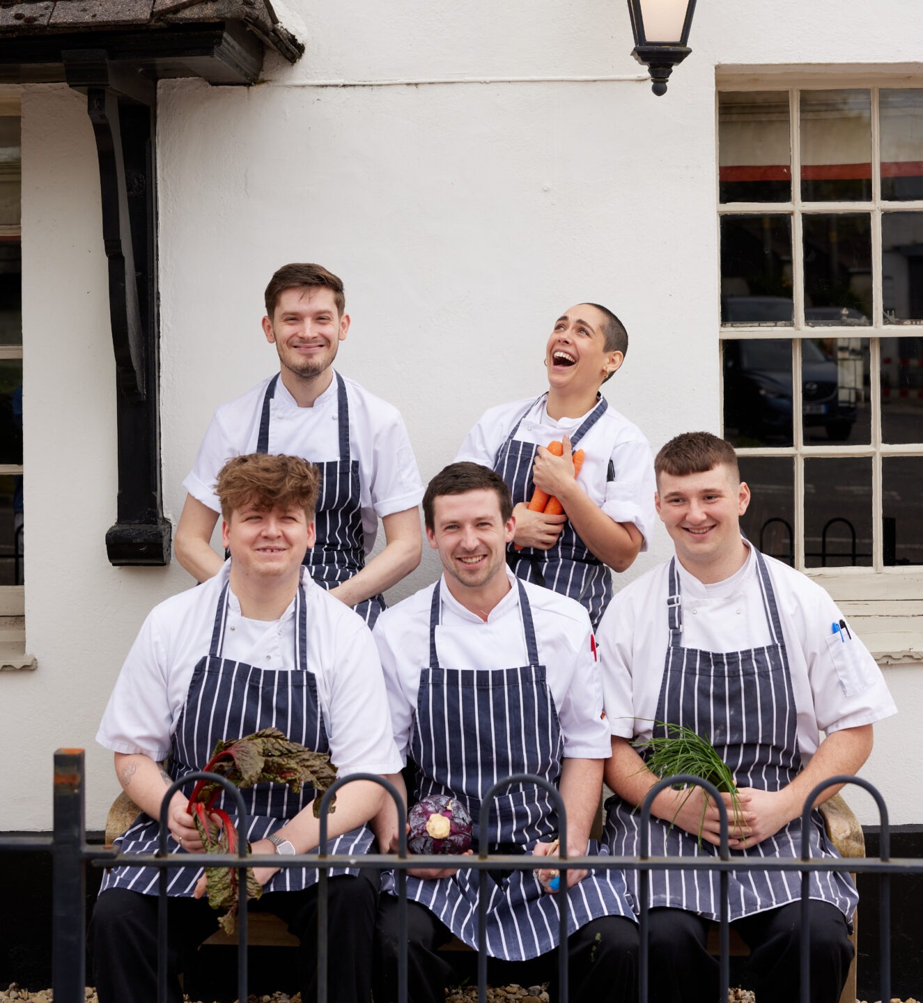 pub team members posing outside venue